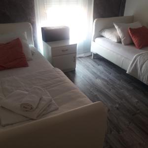 Postel nebo postele na pokoji v ubytování Apartmani Nis