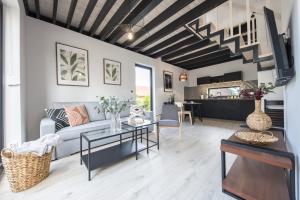 a living room with a couch and a table at SpaceroVa in Nadole +38 photos