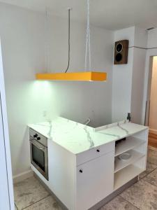 Kuchyň nebo kuchyňský kout v ubytování Hotellos