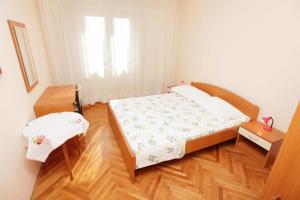 Postel nebo postele na pokoji v ubytování Apartments Dubravka