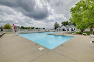 a large swimming pool with blue water at Camby Home with 3 Living Areas and Community Pool! in Plainfield
