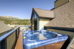 a blue tub sitting on a deck on a house at Unbelievable Location on Main Street - Walk Everywhere, Private Hot Tub! DOG FRIENDLY SCC4 in Breckenridge