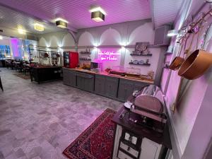 a hair salon with purple lighting in a room at Hafen Hotel Schützenhof in Burg auf Fehmarn