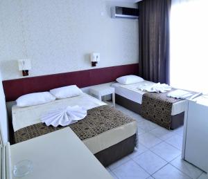 Postel nebo postele na pokoji v ubytování Sun Kiss Hotel + 20 fotografií