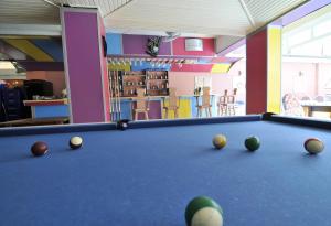 a billiard room with a pool table and balls at Sun Kiss Hotel in Side