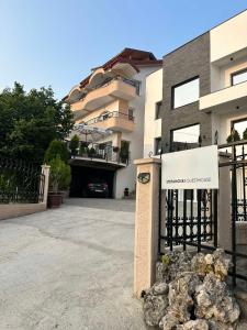 a building with a gate with a sign on it at Villa Stefanoski in Konsko