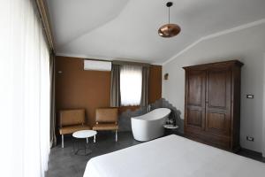 a hotel room with a bed and a bathroom at The APARTMENT in Tivoli