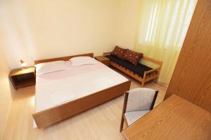 Postel nebo postele na pokoji v ubytování Apartments Dubravka