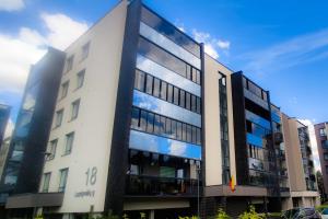 an office building with a lot of windows at Erdvi studija Spacious studio apartment Self check in in Vilnius
