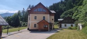 a large house with a gambrel roof at Apartment Angerer Bad Aussee in Bad Aussee