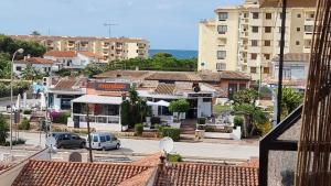 a view of a city with buildings and cars at Apartamentos La Goleta 1 in Denia