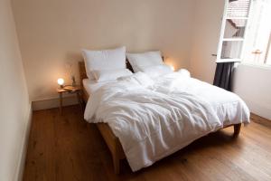 מיטה או מיטות בחדר ב-Palais Wunderlich
