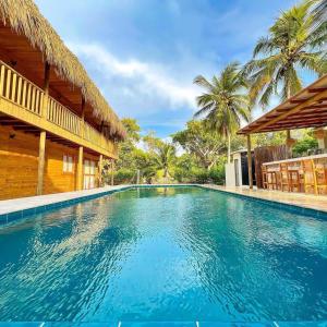 a swimming pool in the middle of a house at Awa de Mar Playa in Tolú