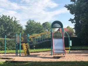 a playground with a slide in a park at Ferienwohnung zum Tiefenthal 