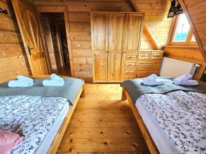 Posteľ alebo postele v izbe v ubytovaní Góralski Dom - Widokowa Osada Gawlaki Zakopane - Loft Affair