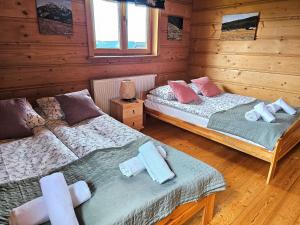 Posteľ alebo postele v izbe v ubytovaní Góralski Dom - Widokowa Osada Gawlaki Zakopane - Loft Affair