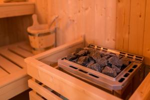 a stove in a kitchen with a bunch of coal at VacationClub - Podgórzyńska 6A Apartament 5 in Jelenia Góra