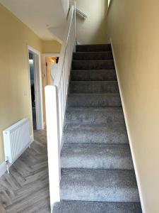 a stairway in a house with a stair case at Heart of kinsale in Kinsale