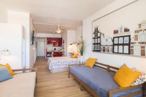 a room with two beds and a living room at ABC - Apartment Beach & City + Balcony 6m2 in Las Palmas de Gran Canaria