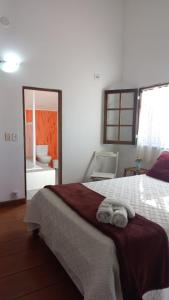 Postel nebo postele na pokoji v ubytování Villa dos Pássaros Paraty Hospedagem