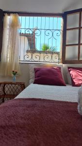 Postel nebo postele na pokoji v ubytování Villa dos Pássaros Paraty Hospedagem
