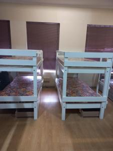 two sets of bunk beds in a room at Home Away From Home in Cape Town