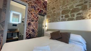 Postel nebo postele na pokoji v ubytování Hotel Felice