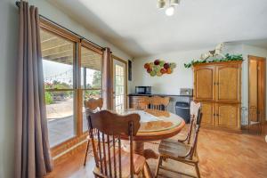 a dining room with a table and chairs and a kitchen at Fredericksburg Retreat with Private Hot Tub and Patio! in Fredericksburg