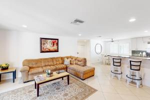 a living room with a couch and a table at Fred Waring Dreams in Palm Desert