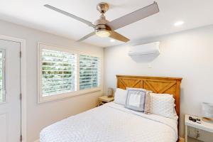 a bedroom with a bed and a ceiling fan at Fred Waring Dreams in Palm Desert