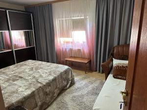Postel nebo postele na pokoji v ubytování Casa Vio parter