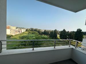 a balcony with a view of a city at Enigma Apartment in Ulcinj