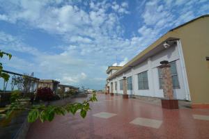 a row of buildings with a blue sky in the background at Hotel Royal Highness in Tinsukia