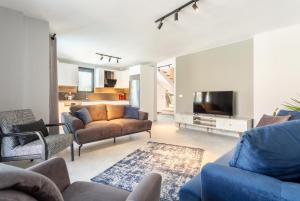 TV a/nebo společenská místnost v ubytování Villa Exclusive Paradise 3