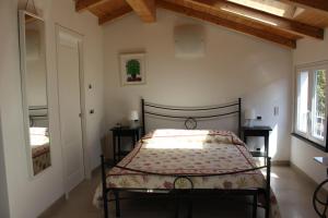 a bedroom with a bed and a window at Le Caravelle in Levanto
