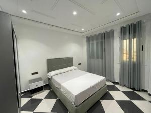 Postel nebo postele na pokoji v ubytování Dina Apartments