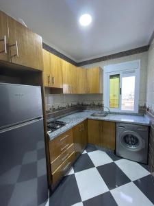 Кухня або міні-кухня у Hiba Apartments