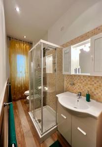 a bathroom with a shower and a sink at La casa dei sogni in Falconara Marittima