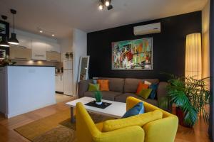 a living room with a couch and a table at Apartment Sladic in Sisak