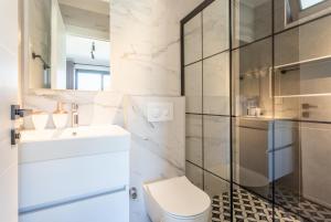 a bathroom with a toilet and a sink and a shower at Villa Exclusive Paradise 2 in Dalyan +10 photos