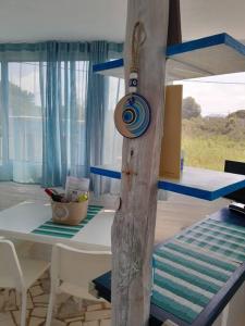 a table and chairs in a room with a dining room at Stefanos' Art House in Halikounas +19 photos