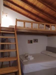 Posteľ alebo postele v izbe v ubytovaní LIMENARI COTTAGE