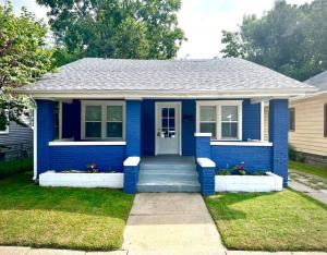 a small blue house with a blue door at Cozy 2 Bedroom Home near Notre Dame in South Bend