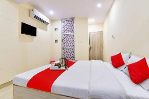 En eller flere senger på et rom på Super OYO Hotel Tourist Residency