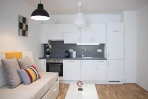 Kuchyň nebo kuchyňský kout v ubytování Flat2go modern apartments - Harmony of city and nature