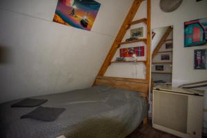A bed or beds in a room at Centro Apartman