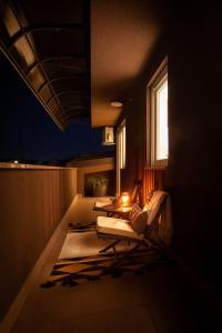 a room with three tables and a window at night at Apartment Sladic in Sisak