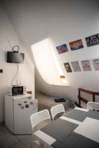 Televízia a/alebo spoločenská miestnosť v ubytovaní C2 apartman + 22 fotografií