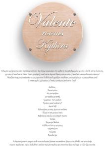 a wooden circle with a sign that reads valentine rooms syndrome at Valente Rooms Kythira in Kythira