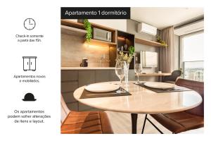 - une table dans la cuisine avec salle à manger dans l'établissement Charlie Wide Pinheiros, à São Paulo